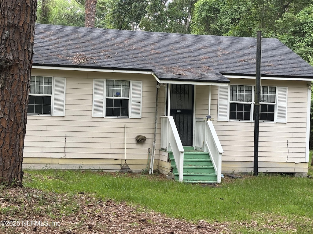 4525 Kenndle Cir, Jacksonville, FL 32208 - view of front of home with a shingled roof