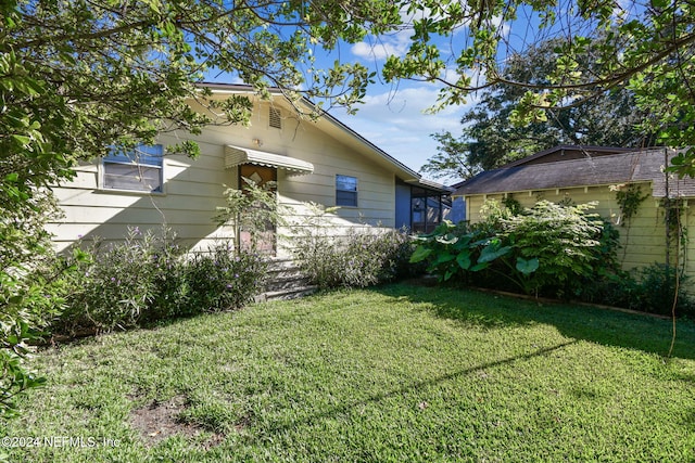 exterior space with a lawn