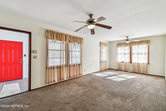 interior space featuring carpet and ceiling fan