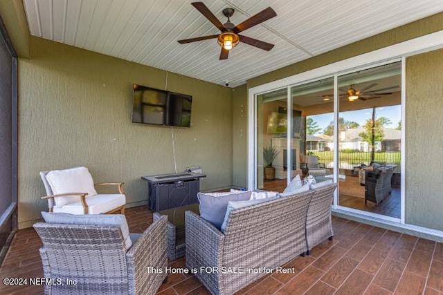 view of patio featuring an outdoor living space and ceiling fan