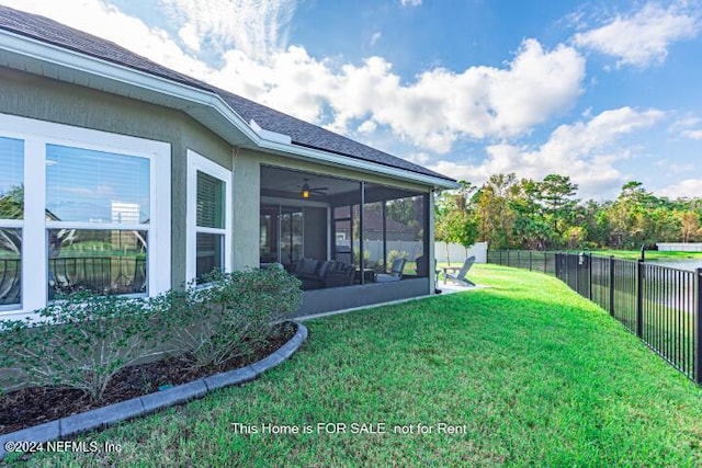 view of yard featuring a sunroom