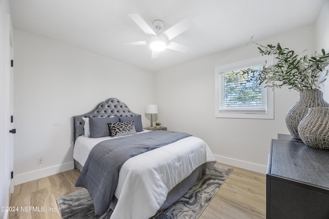 bedroom featuring hardwood / wood-style floors and ceiling fan