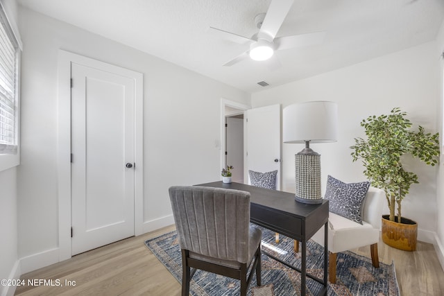 interior space with ceiling fan and light hardwood / wood-style flooring