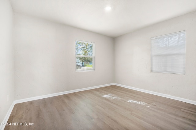 empty room with hardwood / wood-style floors