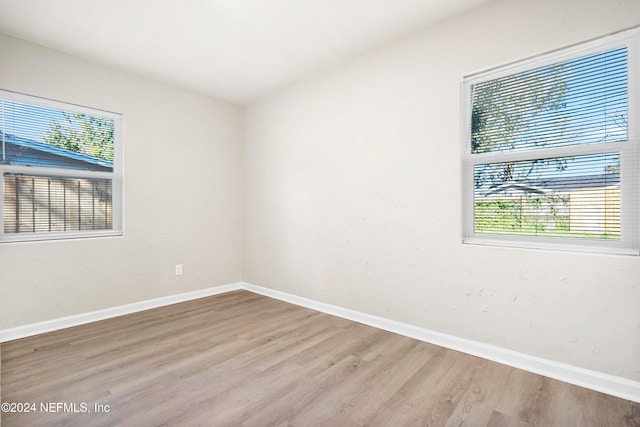 spare room featuring light hardwood / wood-style flooring