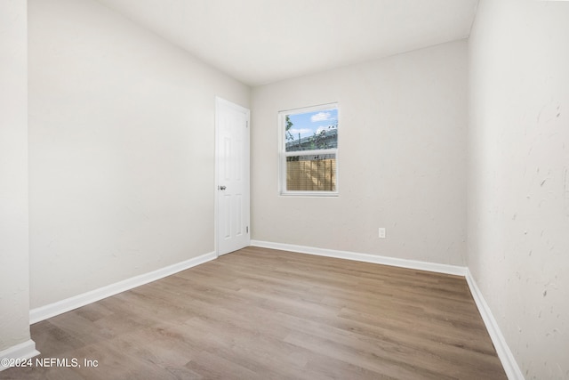 empty room with light hardwood / wood-style floors