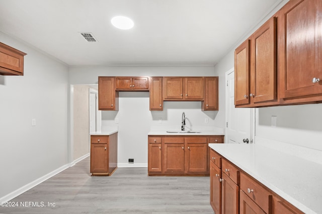 kitchen featuring light hardwood / wood-style floors and sink