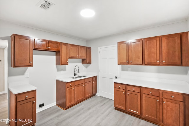 kitchen featuring light hardwood / wood-style flooring and sink