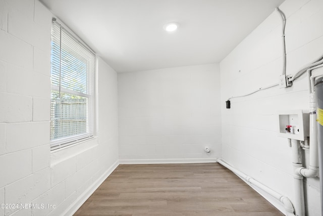 laundry area featuring hardwood / wood-style flooring and washer hookup