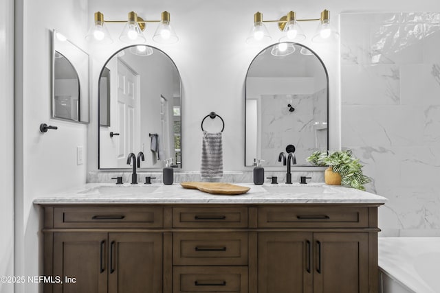 bathroom featuring a bath and vanity