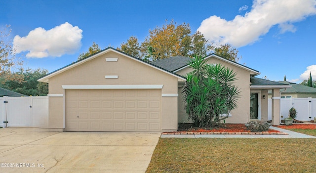 single story home featuring a garage and a front yard