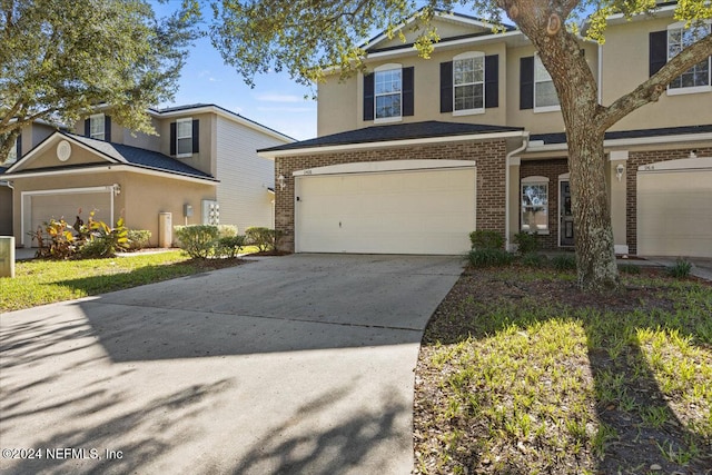 front of property with a garage