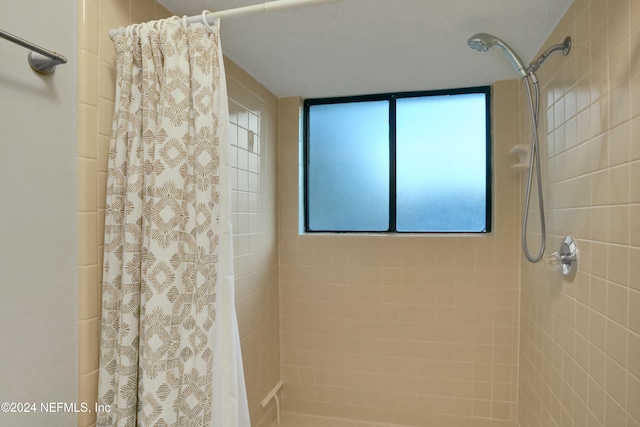 bathroom with a shower with curtain