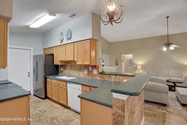 kitchen featuring sink, stainless steel fridge with ice dispenser, high vaulted ceiling, kitchen peninsula, and white dishwasher