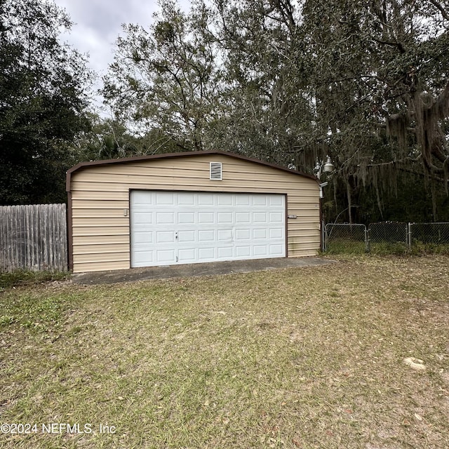 garage with a lawn