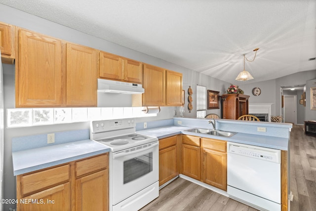 kitchen with sink, kitchen peninsula, pendant lighting, wood-type flooring, and white appliances