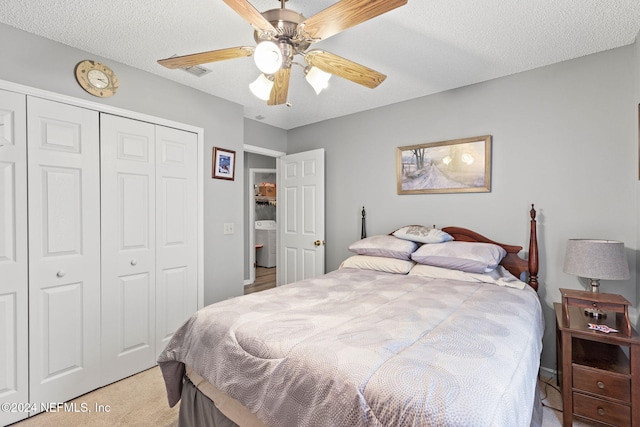 bedroom with light carpet, a textured ceiling, a closet, and ceiling fan