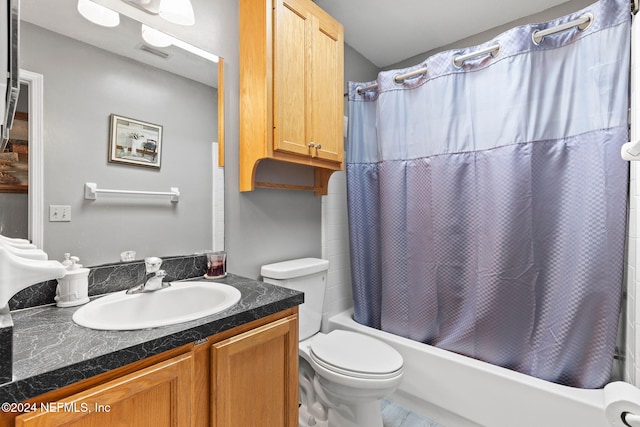 full bathroom with toilet, vanity, and shower / tub combo with curtain