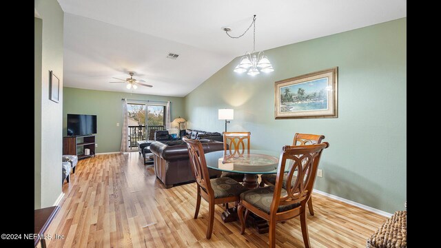 19 Arbor Club Dr Unit 317, Ponte Vedra Beach, FL 32082 - dining area featuring light wood finished floors, vaulted ceiling, baseboards, ceiling fan, and a chandelier