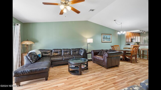 19 Arbor Club Dr Unit 317, Ponte Vedra Beach, FL 32082 - living area featuring vaulted ceiling, light wood-style flooring, ceiling fan, and a chandelier