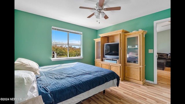 bedroom featuring light wood-type flooring and ceiling fan