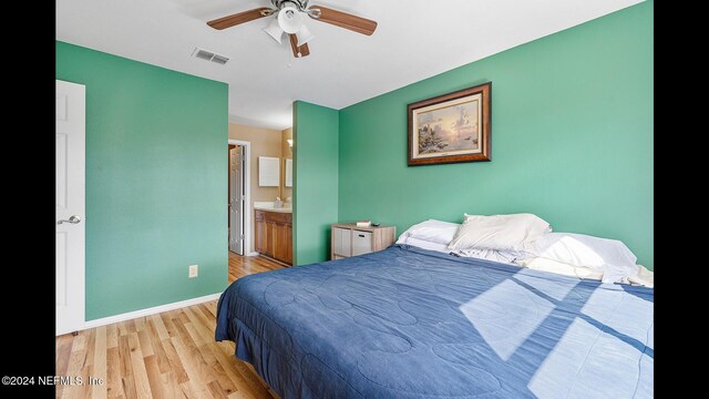 19 Arbor Club Dr Unit 317, Ponte Vedra Beach, FL 32082 - bedroom featuring light wood-style flooring, baseboards, connected bathroom, ceiling fan, and a sink