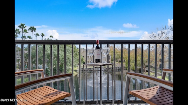 balcony featuring a water view