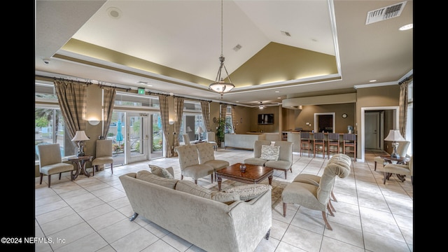 living room featuring lofted ceiling, french doors, a raised ceiling, ceiling fan, and light tile patterned floors