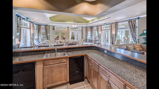 19 Arbor Club Dr Unit 317, Ponte Vedra Beach, FL 32082 - bar with black dishwasher, a sink, light tile patterned floors, pendant lighting, and crown molding