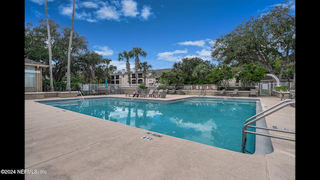 view of pool featuring a patio