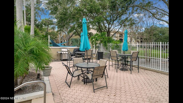 19 Arbor Club Dr Unit 317, Ponte Vedra Beach, FL 32082 - view of patio / terrace with fence and outdoor dining space