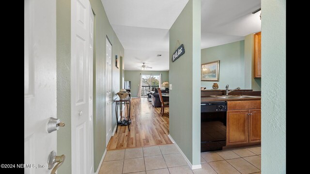 19 Arbor Club Dr Unit 317, Ponte Vedra Beach, FL 32082 - hall with light tile patterned floors, a sink, baseboards, and a textured wall