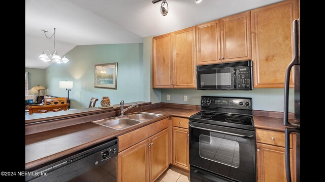 19 Arbor Club Dr Unit 317, Ponte Vedra Beach, FL 32082 - kitchen featuring black appliances, a sink, lofted ceiling, dark countertops, and light tile patterned floors