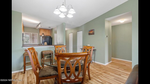 19 Arbor Club Dr Unit 317, Ponte Vedra Beach, FL 32082 - dining area featuring light wood-style flooring, a chandelier, baseboards, and track lighting