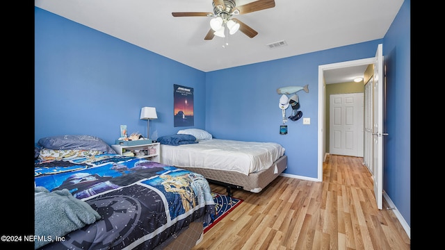 bedroom featuring ceiling fan and light wood-type flooring