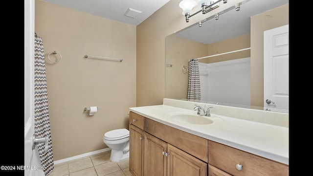 bathroom featuring tile patterned floors, vanity, a shower with shower curtain, and toilet