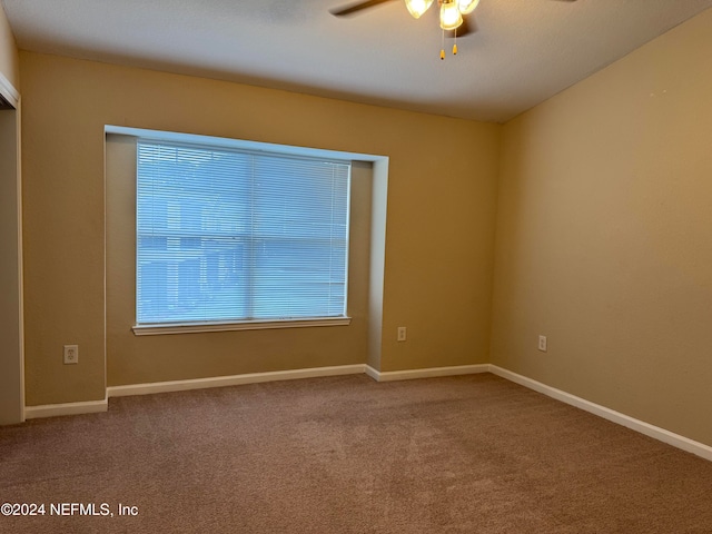 carpeted empty room with ceiling fan