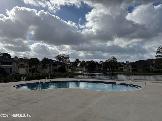 view of swimming pool with a patio area