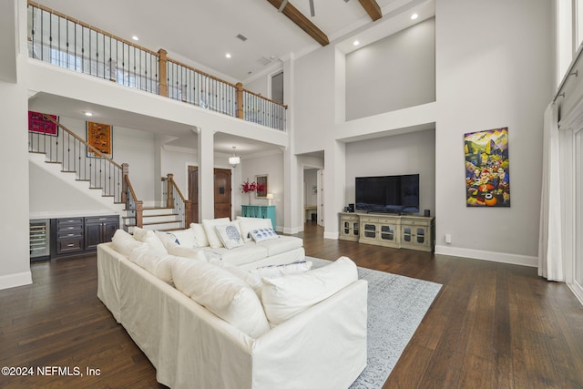 living room with beamed ceiling, dark hardwood / wood-style floors, beverage cooler, and a high ceiling