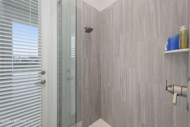 bathroom with a tile shower