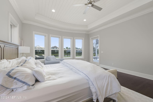 bedroom with a raised ceiling, ceiling fan, hardwood / wood-style floors, and ornamental molding