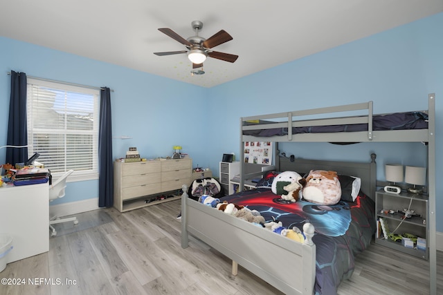 bedroom featuring hardwood / wood-style floors and ceiling fan