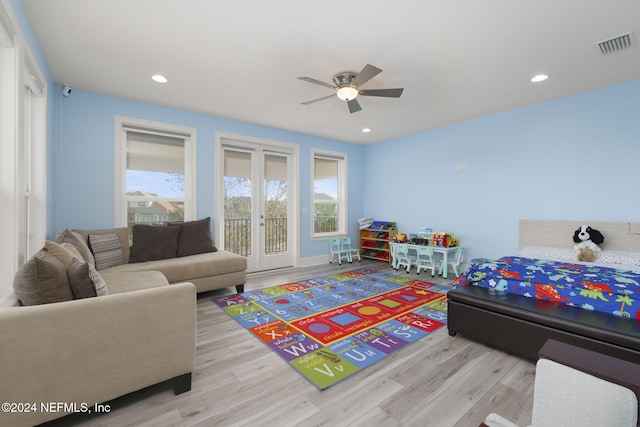 bedroom with ceiling fan, access to exterior, and light hardwood / wood-style flooring