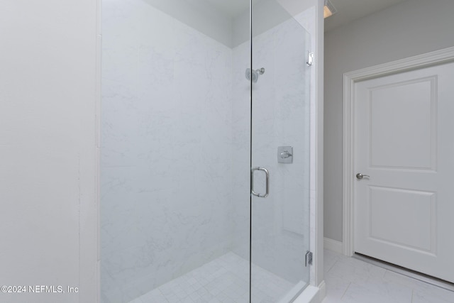 bathroom featuring an enclosed shower