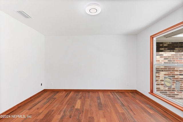 spare room featuring hardwood / wood-style flooring