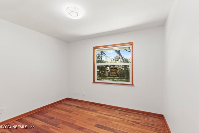 empty room with wood-type flooring