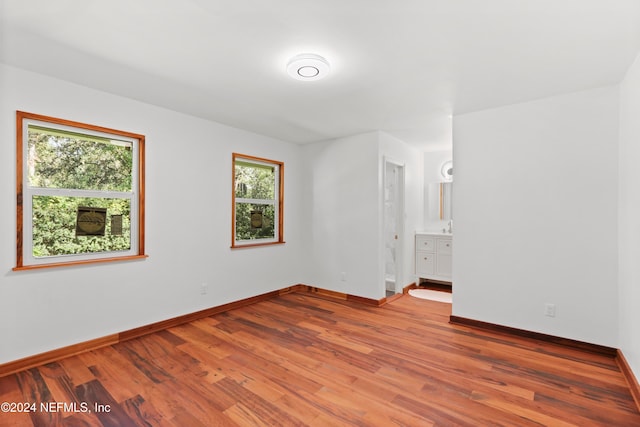 unfurnished room with light hardwood / wood-style flooring