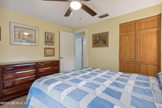 bedroom with carpet, a closet, and ceiling fan