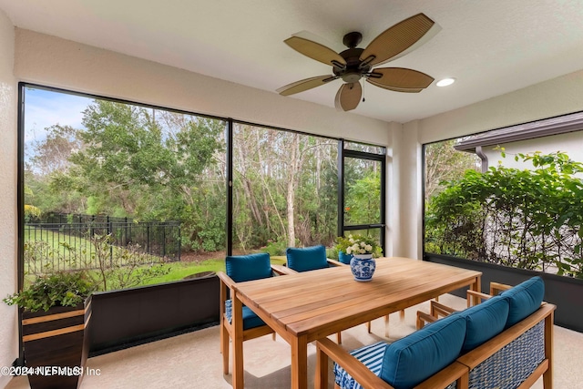 sunroom / solarium with ceiling fan