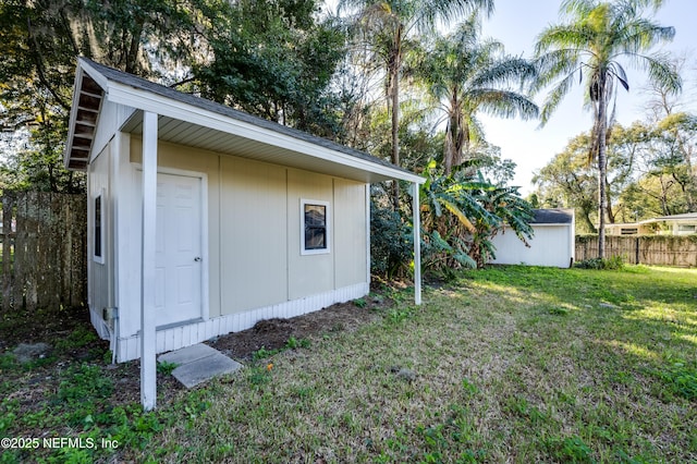 view of outbuilding with a lawn